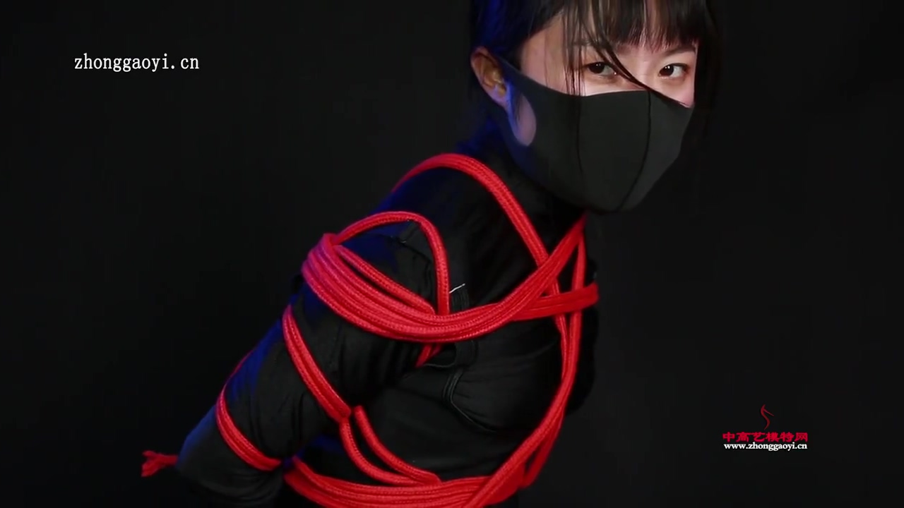 Ninja Girl Tied In Red Ropes
